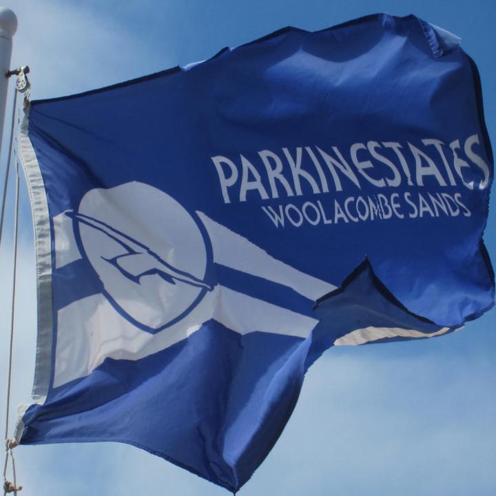 Parkin Estates Flag flying on Woolacombe Beach North Devon
